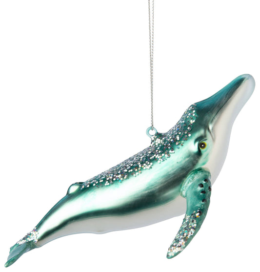Glass sperm whale ornament.