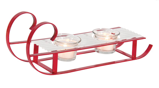 White and red enamel metal sled with 2 glass tealight cups.